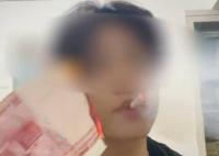 男子为炫富烧100元点烟被罚1万 民警依法对其处以警告